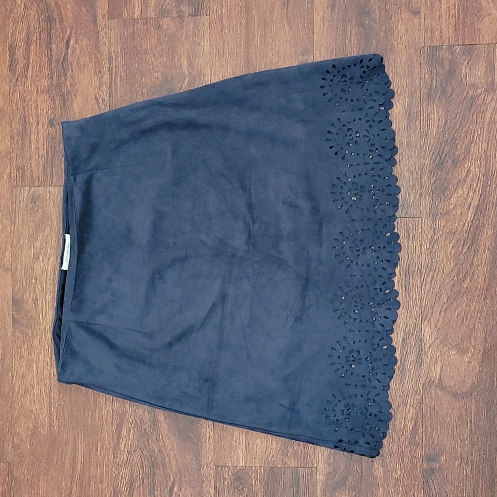 Blue skirt. Above the knee,  skies are blue medium